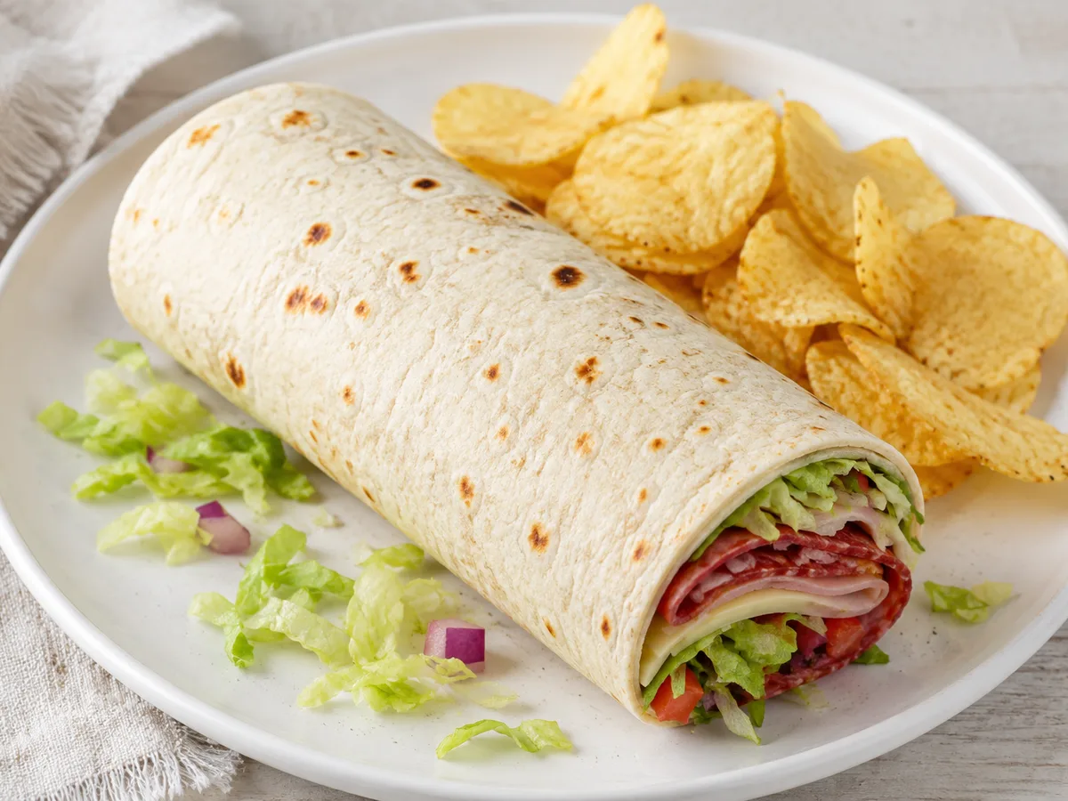 Jersey Mike's wrap served whole with a side of chips